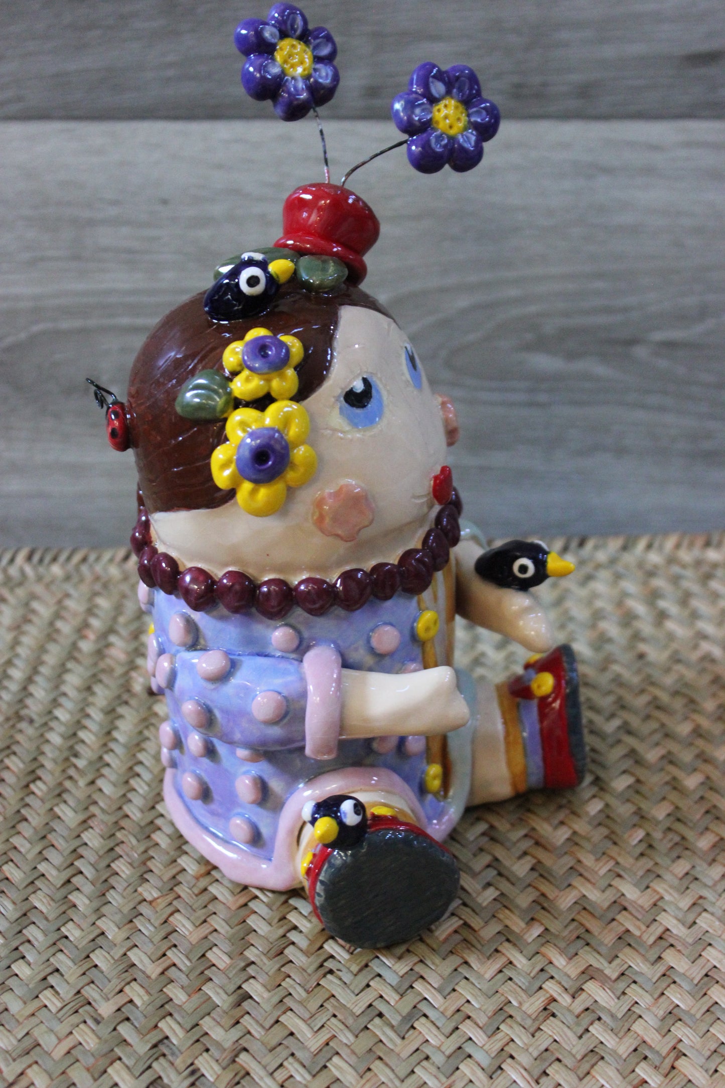 Ceramic Brown Haired Girl Doll Sculpture with Flowers, Birds and Ladybugs