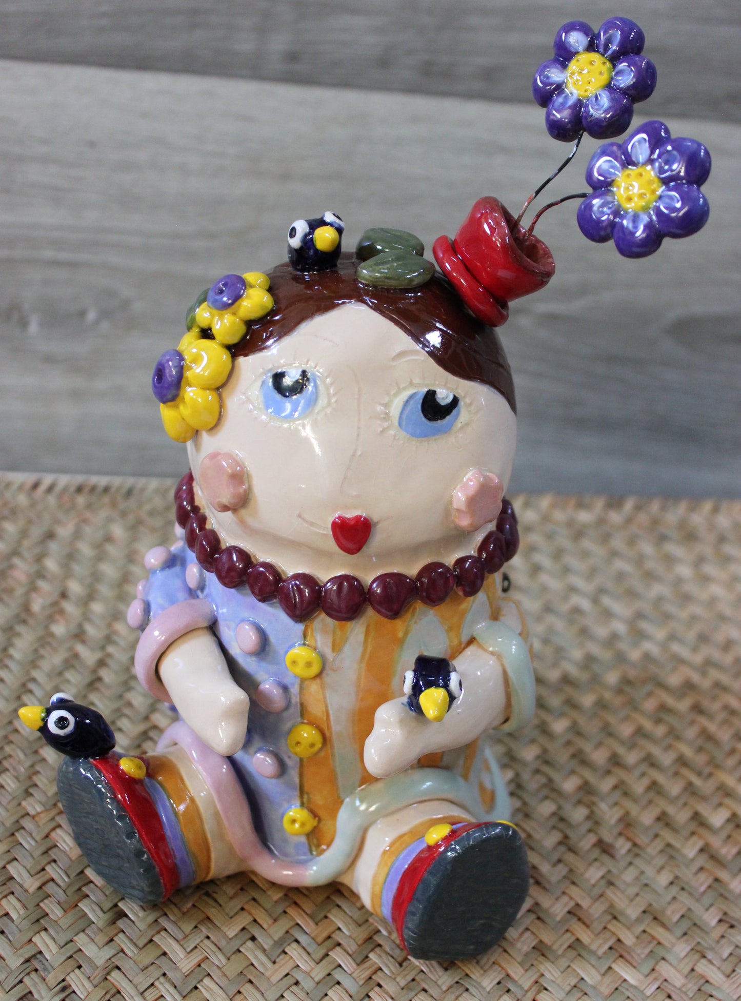 Ceramic Brown Haired Girl Doll Sculpture with Flowers, Birds and Ladybugs